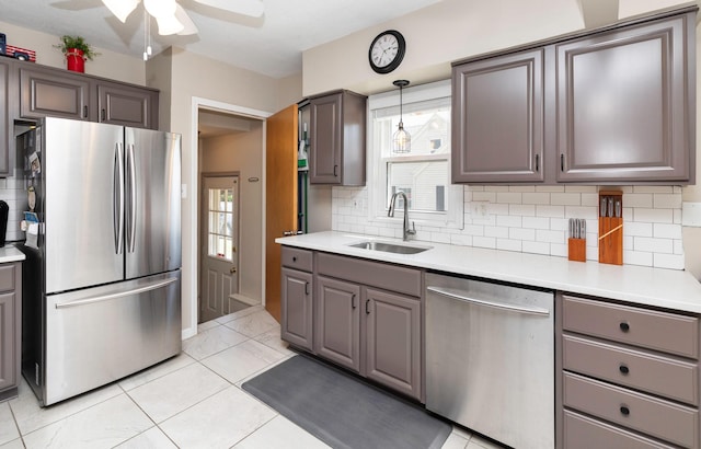 1808 60th St, Des Moines, IA 50322 - kitchen featuring stainless steel appliances, ceiling fan, and decorative backsplash