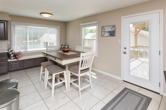 1808 60th St, Des Moines, IA 50322 - dining area featuring baseboards and light tile patterned flooring