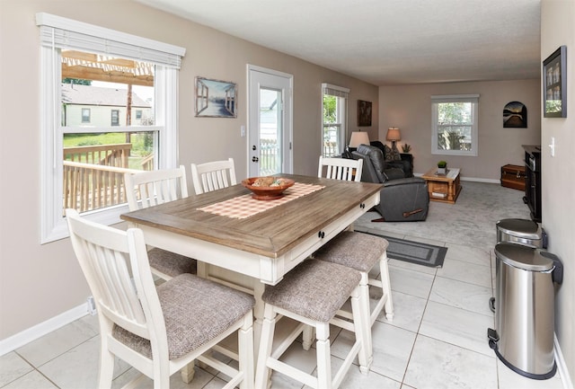 1808 60th St, Des Moines, IA 50322 - dining room featuring light tile patterned flooring