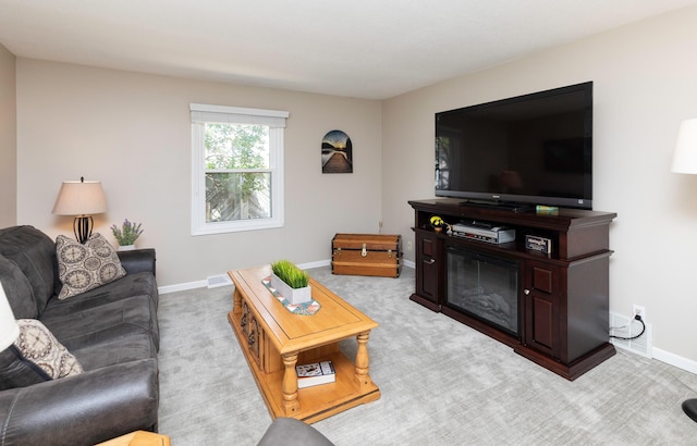 1808 60th St, Des Moines, IA 50322 - living room with baseboards and carpet floors