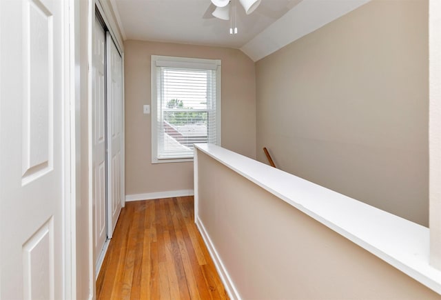 1808 60th St, Des Moines, IA 50322 - corridor featuring an upstairs landing, light wood-type flooring, and lofted ceiling