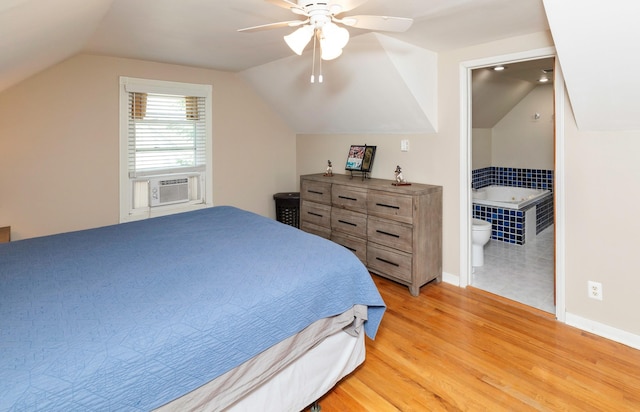 1808 60th St, Des Moines, IA 50322 - bedroom featuring lofted ceiling, light wood-style flooring, cooling unit, connected bathroom, and ceiling fan