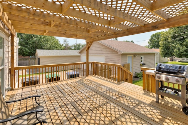 1808 60th St, Des Moines, IA 50322 - deck with an outdoor structure, a garage, and a pergola
