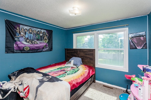 4505/4507 51st St, Des Moines, IA 50310 - carpeted bedroom with a textured ceiling