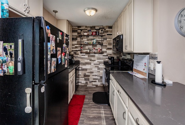 4505/4507 51st St, Des Moines, IA 50310 - kitchen with black appliances, dark countertops, dark wood-style floors, and tasteful backsplash