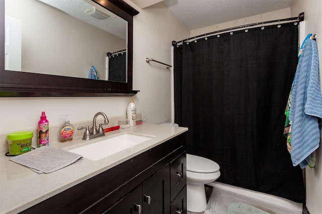 4505/4507 51st St, Des Moines, IA 50310 - bathroom featuring vanity, a textured ceiling, and curtained shower