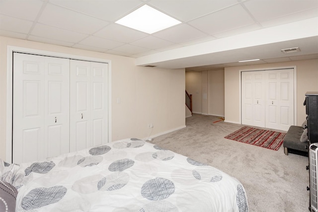 4505/4507 51st St, Des Moines, IA 50310 - bedroom with carpet floors, a drop ceiling, and a closet
