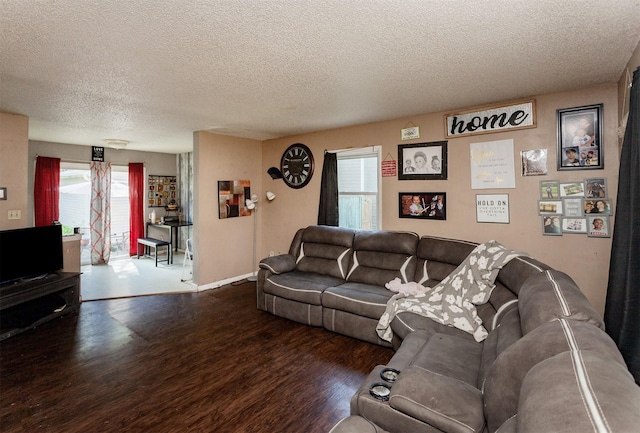 4505/4507 51st St, Des Moines, IA 50310 - living area featuring a textured ceiling, wood finished floors, and plenty of natural light