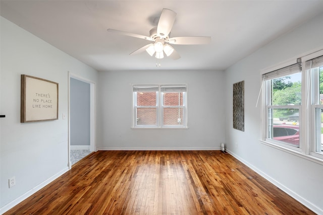 1329 63rd St, Des Moines, IA 50311 - unfurnished room with hardwood / wood-style floors and a ceiling fan
