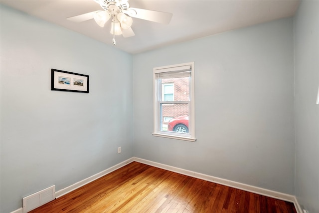 1329 63rd St, Des Moines, IA 50311 - empty room featuring wood-type flooring and ceiling fan