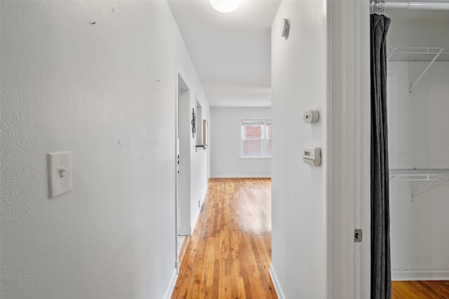 1329 63rd St, Des Moines, IA 50311 - hallway featuring light wood-type flooring and baseboards