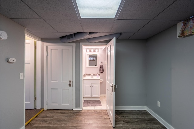 1329 63rd St, Des Moines, IA 50311 - hallway with wood finished floors and a paneled ceiling