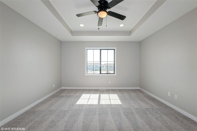 7000 Lake Hill Dr Unit 74, Des Moines, IA 50320 - unfurnished room featuring a tray ceiling, light colored carpet, a ceiling fan, and recessed lighting