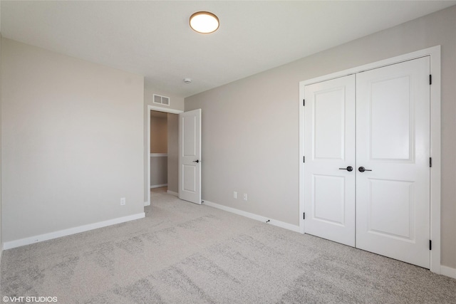 7000 Lake Hill Dr Unit 74, Des Moines, IA 50320 - unfurnished bedroom featuring carpet and a closet