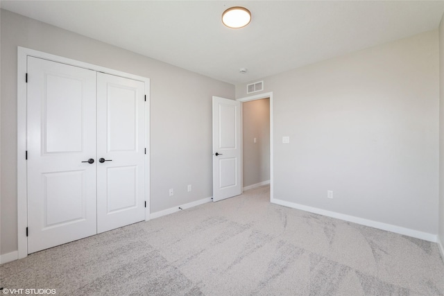 7000 Lake Hill Dr Unit 74, Des Moines, IA 50320 - unfurnished bedroom featuring carpet floors and a closet