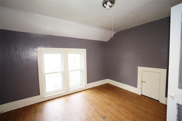 615 11th St, Boone, IA 50036 - bonus room featuring wood finished floors and vaulted ceiling
