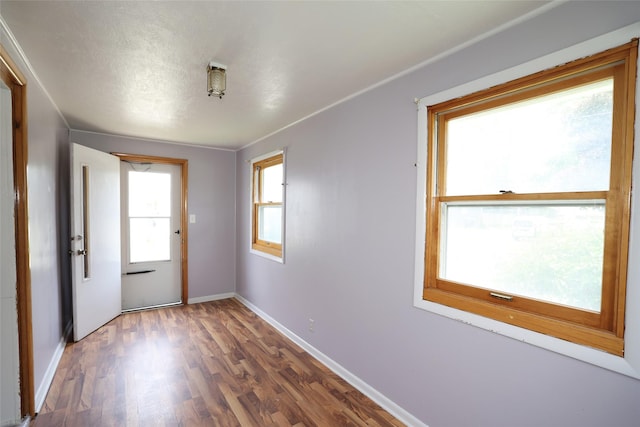 615 11th St, Boone, IA 50036 - spare room with wood finished floors and baseboards