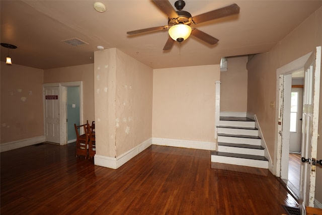 615 11th St, Boone, IA 50036 - unfurnished room with a smoke detector, wood finished floors, ceiling fan, and stairway