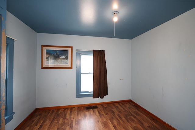 615 11th St, Boone, IA 50036 - empty room with wood finished floors and baseboards