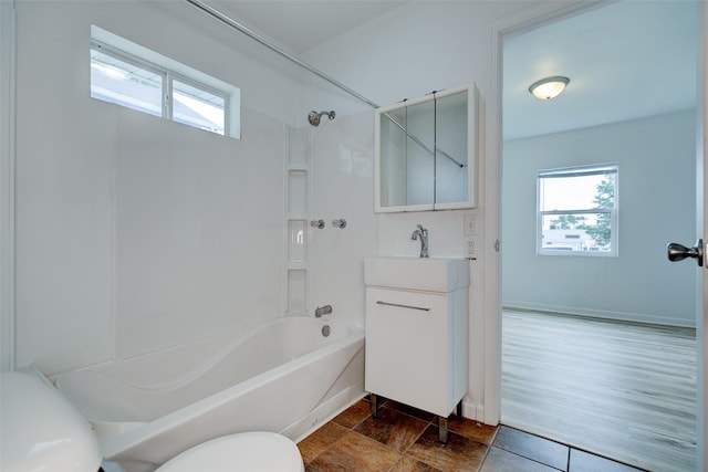 1512 2nd Pl, Des Moines, IA 50314 - bathroom featuring vanity, healthy amount of natural light, and shower / bath combination