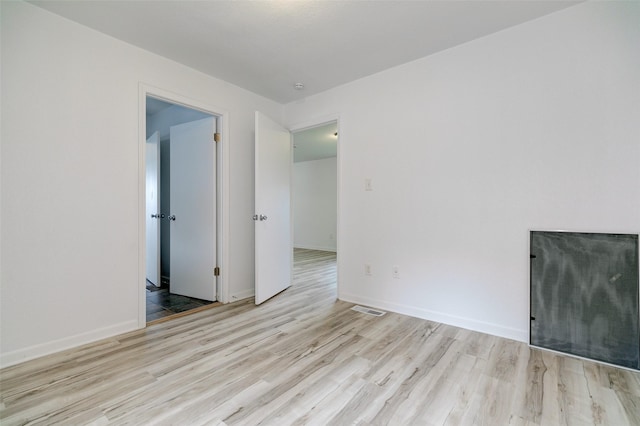 1512 2nd Pl, Des Moines, IA 50314 - unfurnished room featuring wood finished floors and a smoke detector