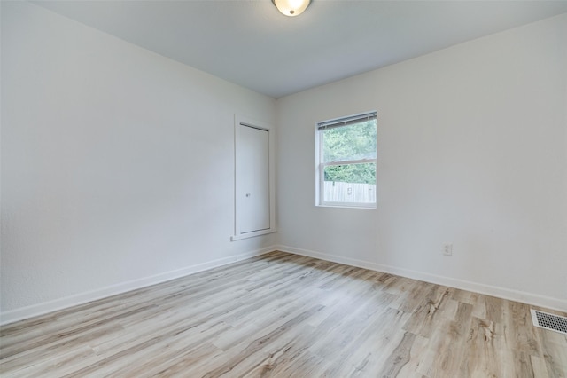 1512 2nd Pl, Des Moines, IA 50314 - spare room featuring wood finished floors and baseboards