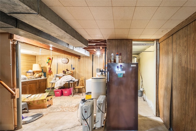 516 Walnut St, De Soto, IA 50069 - finished basement featuring wood walls, water heater, and a water softener system