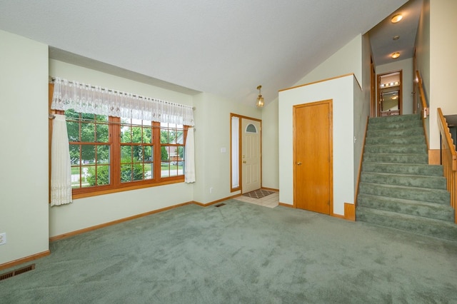 5145 Sycamore Dr, Pleasant Hill, IA 50327 - unfurnished living room featuring carpet, stairs, and lofted ceiling