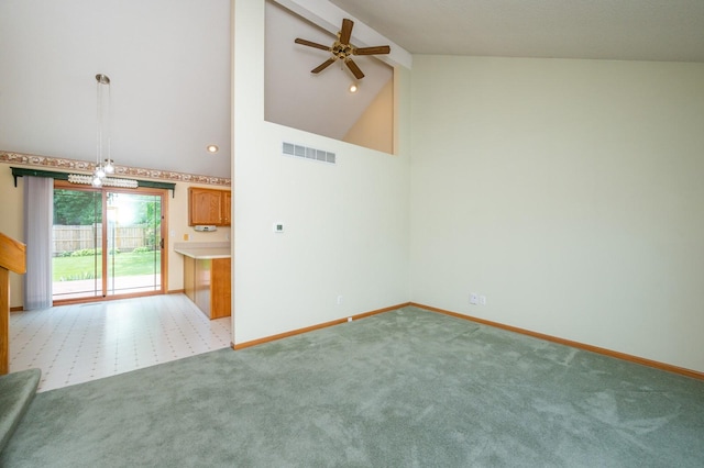 5145 Sycamore Dr, Pleasant Hill, IA 50327 - unfurnished living room featuring a ceiling fan, beamed ceiling, carpet floors, and high vaulted ceiling