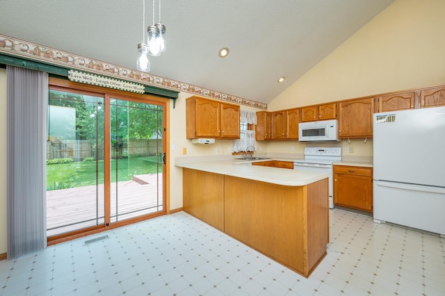 5145 Sycamore Dr, Pleasant Hill, IA 50327 - kitchen featuring white appliances, light flooring, light countertops, brown cabinetry, and a peninsula