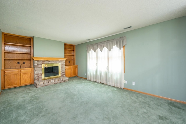 5145 Sycamore Dr, Pleasant Hill, IA 50327 - unfurnished living room with a brick fireplace, light carpet, and built in features