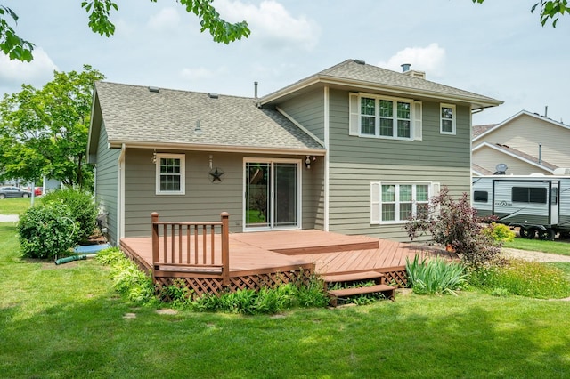 5145 Sycamore Dr, Pleasant Hill, IA 50327 - back of property featuring roof with shingles, a chimney, and a yard