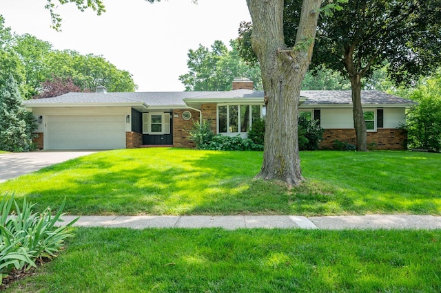 1005 32nd St, West Des Moines, IA 50266 - ranch-style house with brick siding, a chimney, an attached garage, and driveway