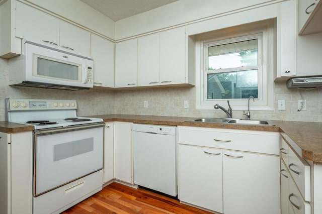 1005 32nd St, West Des Moines, IA 50266 - kitchen featuring white appliances, light wood-type flooring, decorative backsplash, and white cabinets