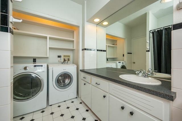 1005 32nd St, West Des Moines, IA 50266 - laundry area featuring independent washer and dryer, light tile patterned floors, and recessed lighting