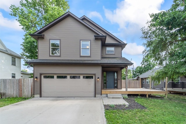 611 Court St, Adel, IA 50003 - view of front of property with an attached garage, driveway, and a deck