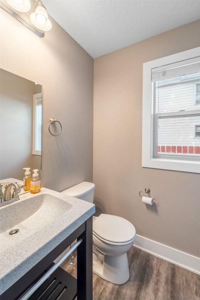 611 Court St, Adel, IA 50003 - bathroom with vanity and wood finished floors