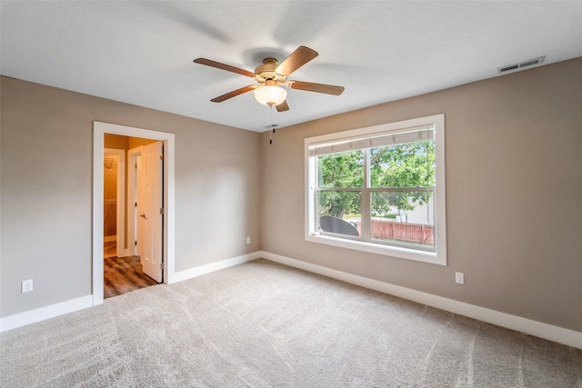 611 Court St, Adel, IA 50003 - carpeted spare room featuring baseboards and ceiling fan