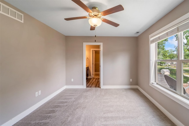 611 Court St, Adel, IA 50003 - carpeted spare room featuring baseboards and ceiling fan