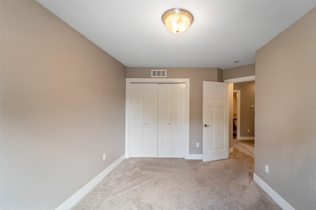 611 Court St, Adel, IA 50003 - unfurnished bedroom with light colored carpet and a closet