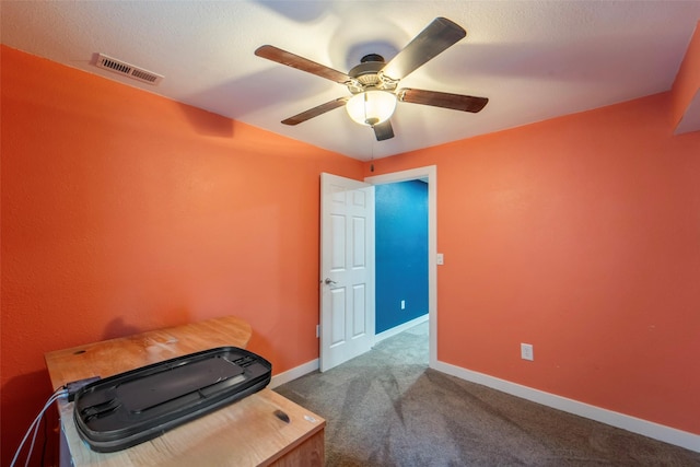 611 Court St, Adel, IA 50003 - empty room featuring a ceiling fan and carpet
