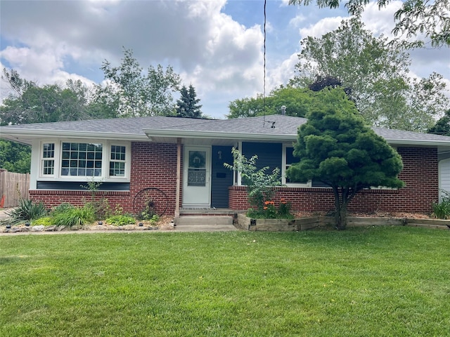 4301 43rd St, Des Moines, IA 50310 - view of front of home featuring brick siding, a front lawn, and roof with shingles