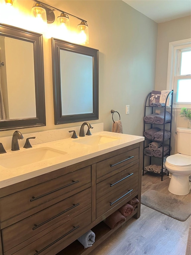 4301 43rd St, Des Moines, IA 50310 - full bathroom with wood finished floors and double vanity