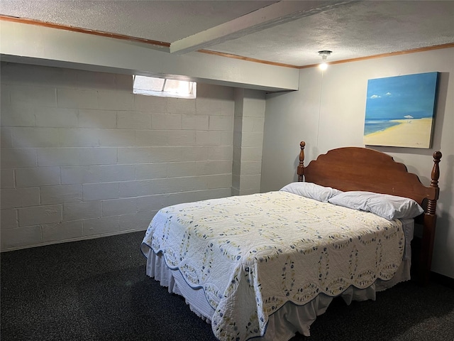 4301 43rd St, Des Moines, IA 50310 - bedroom with ornamental molding, a textured ceiling, carpet floors, and concrete block wall