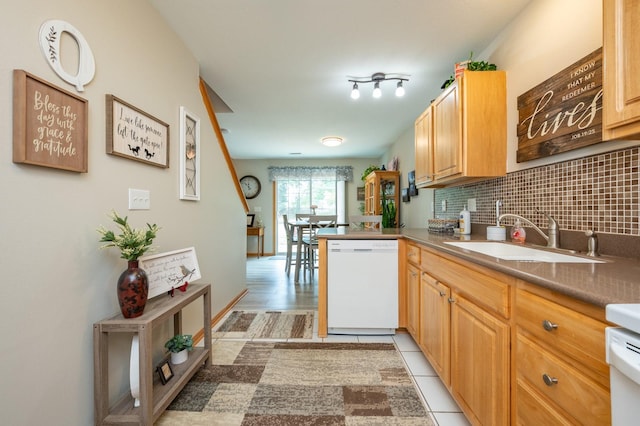 5221 Village Run Ave Unit 1201, Des Moines, IA 50317 - kitchen featuring dishwasher, tasteful backsplash, and a peninsula