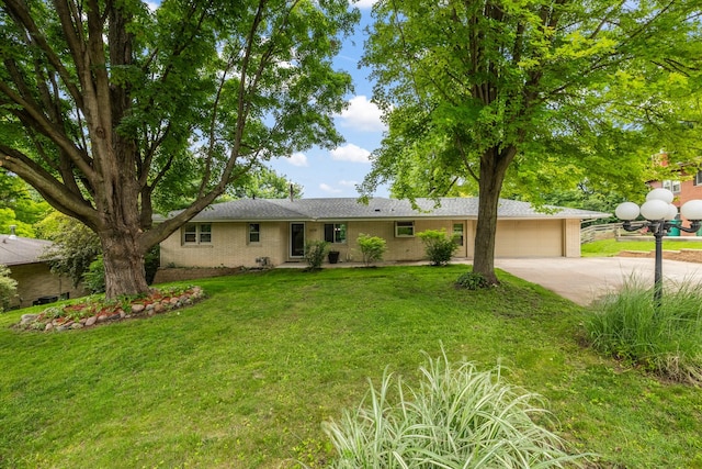 6730 NW Timberline Dr, Des Moines, IA 50313 - ranch-style home featuring an attached garage, driveway, a front lawn, and brick siding