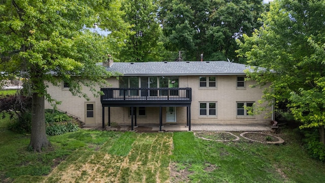 6730 NW Timberline Dr, Des Moines, IA 50313 - back of property with a patio area, a lawn, a wooden deck, and brick siding