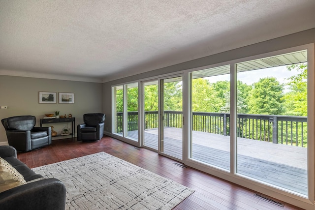 6730 NW Timberline Dr, Des Moines, IA 50313 - living area featuring a textured ceiling and hardwood / wood-style flooring