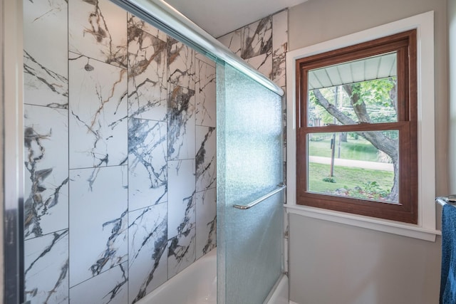 6730 NW Timberline Dr, Des Moines, IA 50313 - bathroom featuring combined bath / shower with glass door