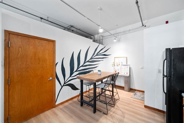 507 E Locust St Unit 308, Des Moines, IA 50309 - dining space with light wood-style flooring